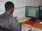 student researching at a computer